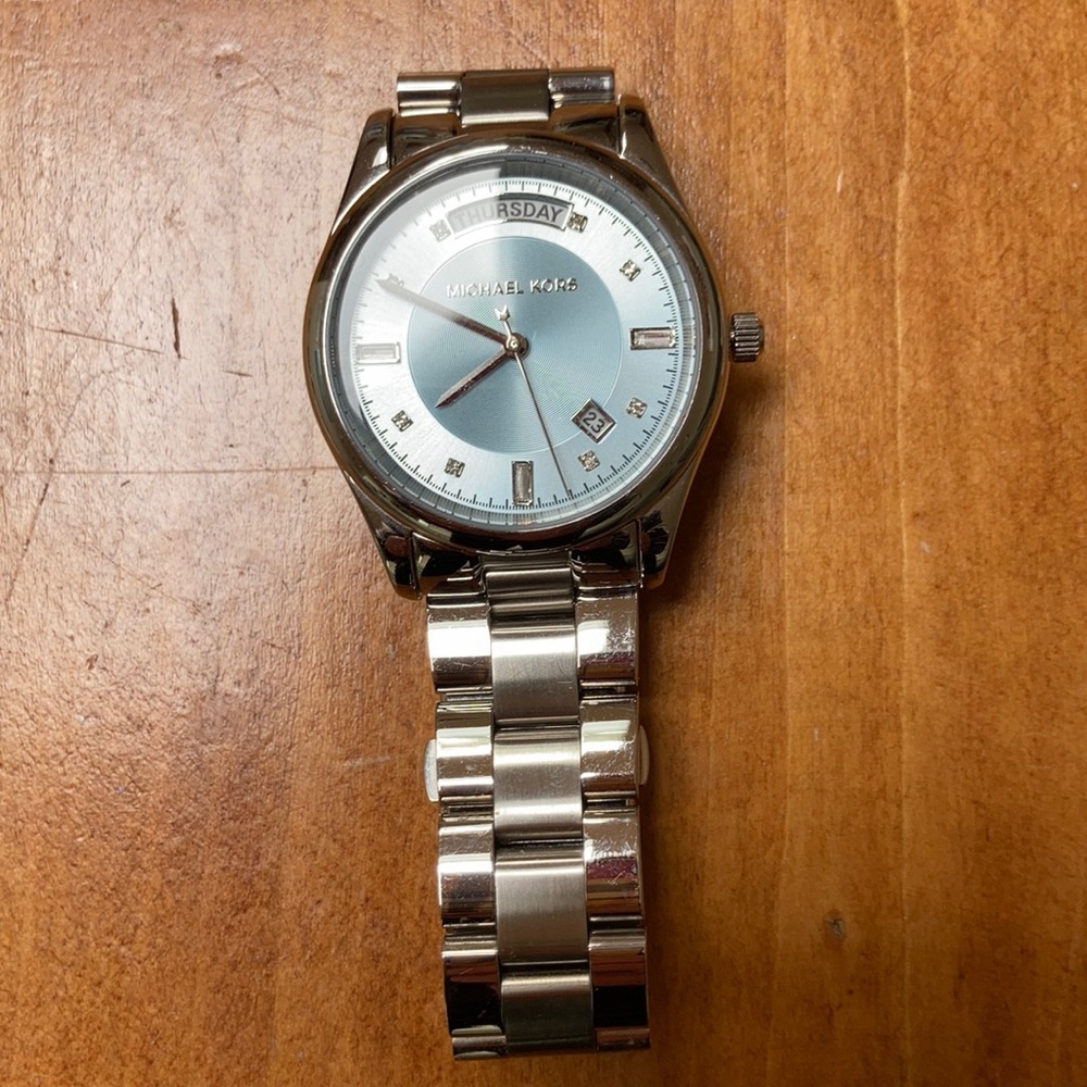 Michael Kors blue face stainless women’s watch.